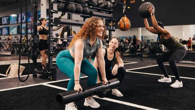 group of people exercising in a small group training class