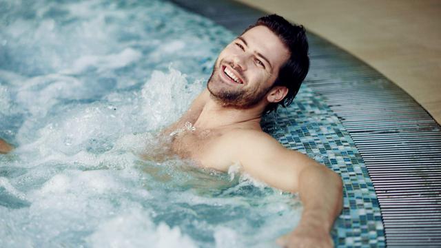 man relaxing in spa