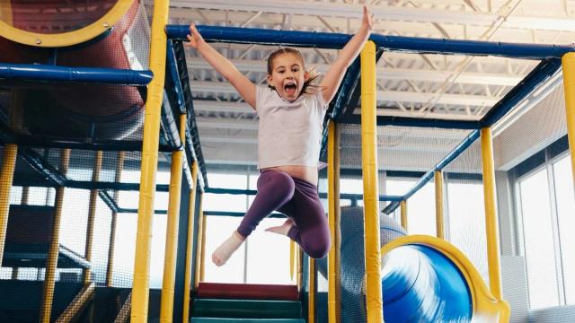 child jumping in kid zone